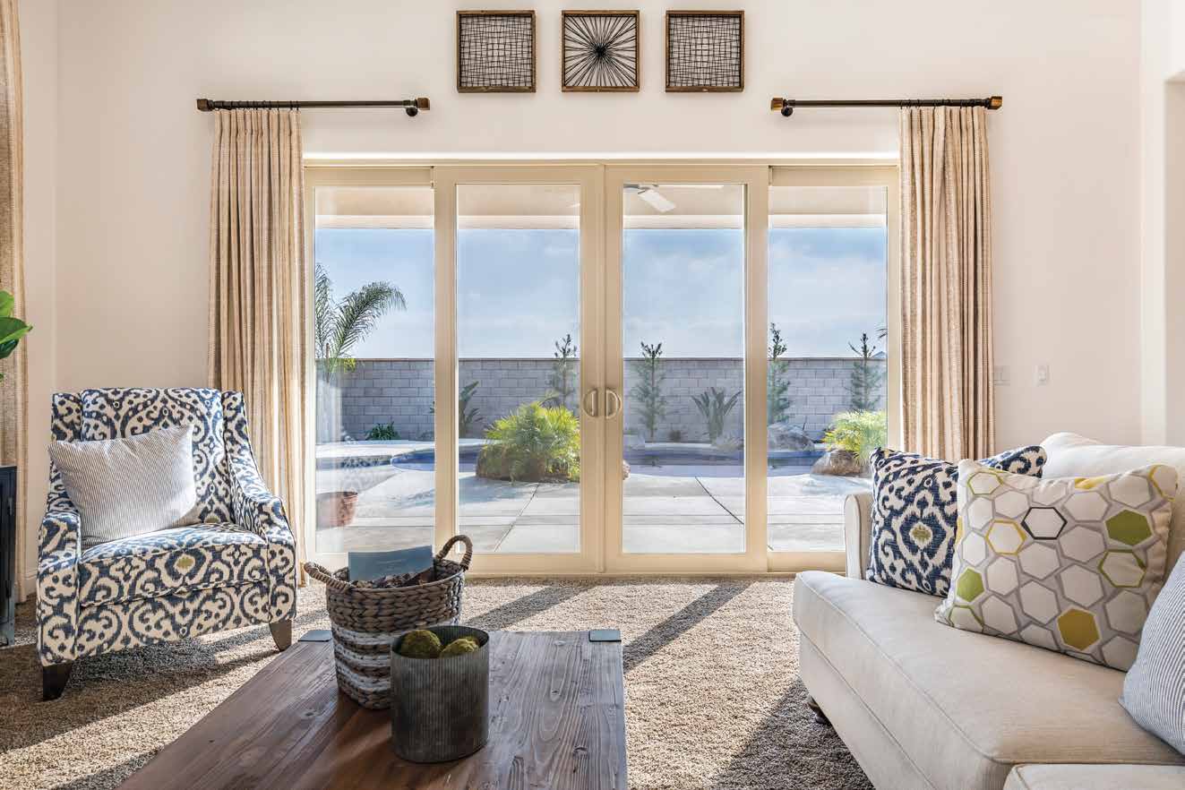 Multi-panel sliding patio door installed in a Sacramento living room — interior view in warm light